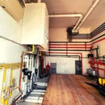 Centrale termica in palazzina (lato) - lavori realizzato dalla Passerini Marco Impianti Idrotermosanitari - idraulico provincia Perugia