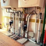 Centrale termica in palazzina (tubature) - lavori realizzato dalla Passerini Marco Impianti Idrotermosanitari - idraulico provincia Perugia